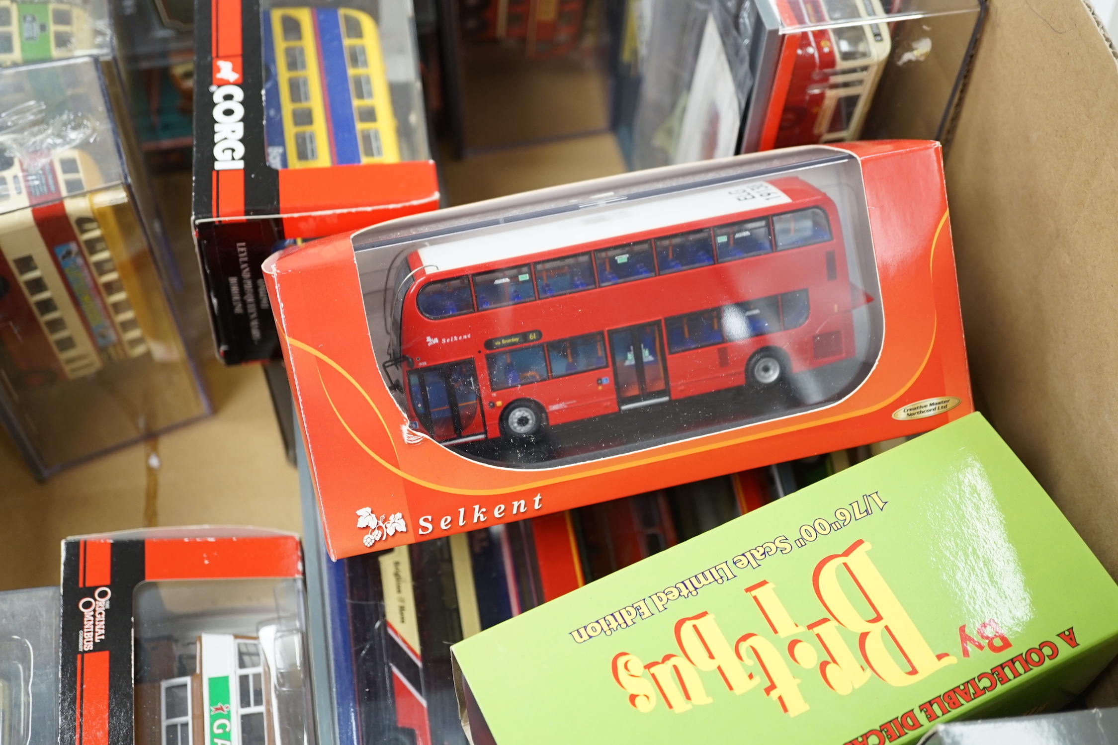 Thirty boxed 1:76 scale buses and coaches by Corgi OOC, Creative Master and Britbus, operators include Brighton & Hove, London Transport, Maidstone & District, East Kent, etc.